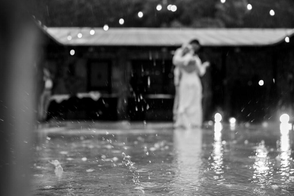 Wedding couple on beach with soft environmental motion blur from ocean waves by Gabe Herrera