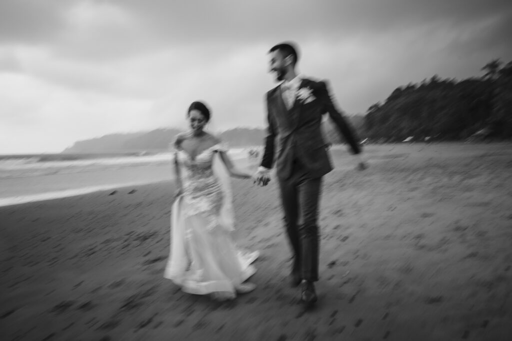 Black and white blurry wedding photo with motion blur during dancing by Mauricio Urena Photography