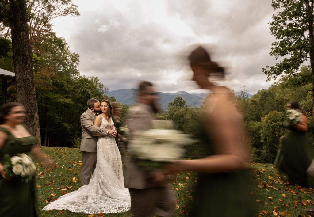 Wedding couple with sharp focus contrasted against blurred environmental movement by JCM Photography