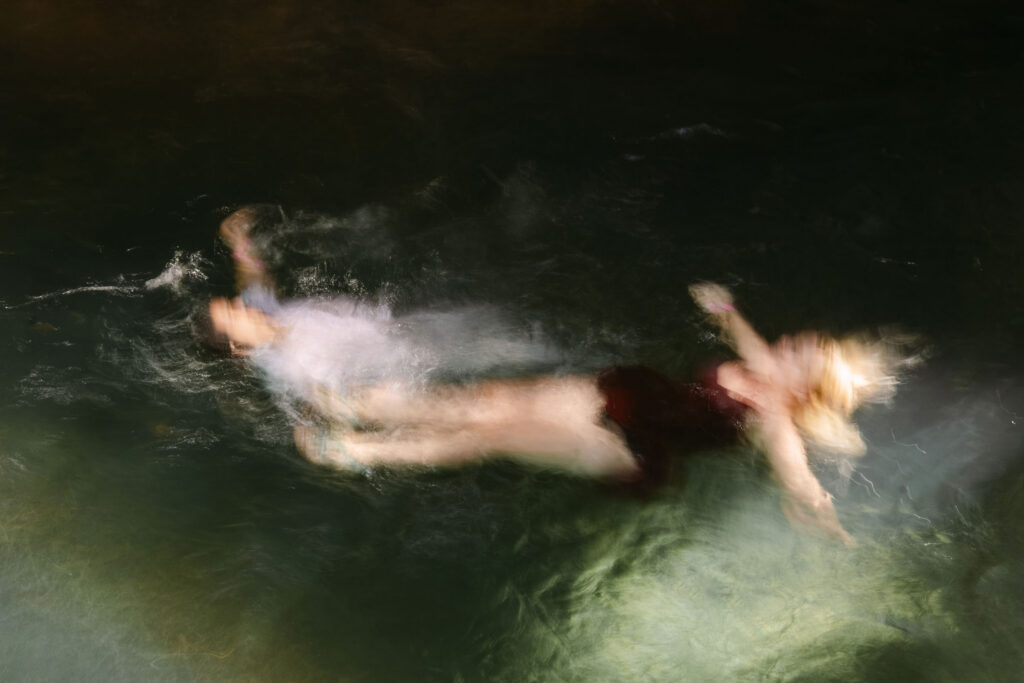 Fully blurred wedding photo with no sharp focal point creating a painterly, mood-driven feel by Kevin Heslin